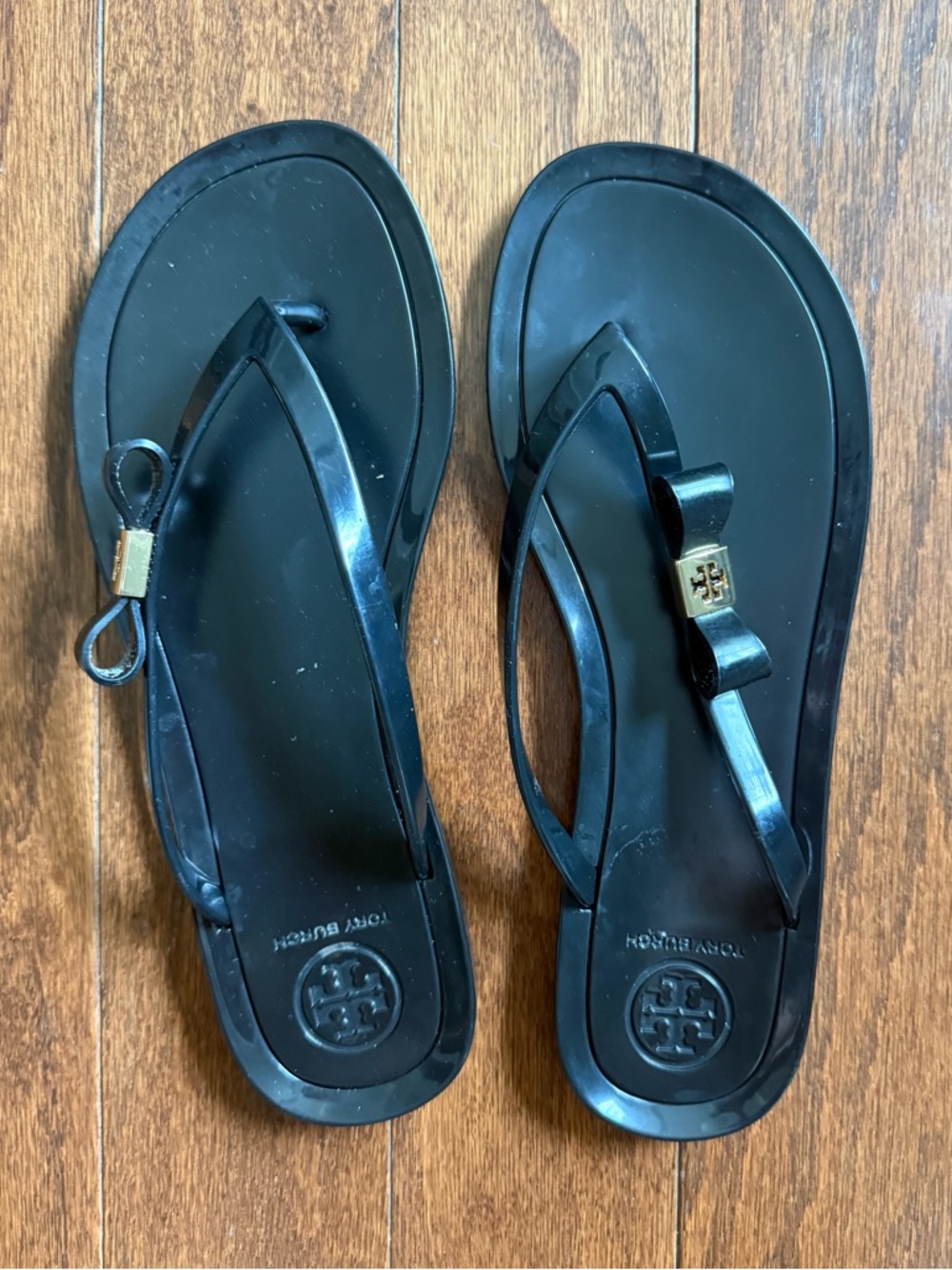 Tory Burch Black Jelly Bow Flip Flops with Gold Logo Accent